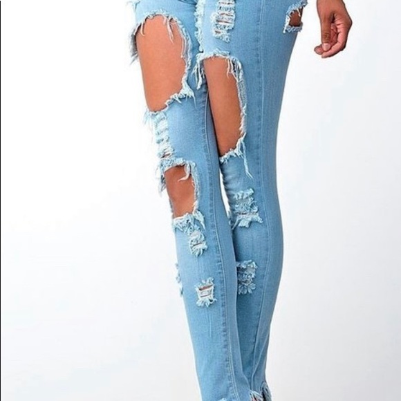 Distressed Denim With Ripped Bell Bottoms - Picture 2 of 8
